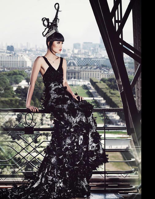 Jessica Minh Anh on the Eiffel Tower wearing Dar Naseem AlAndalos, Buccellati, Mont Blanc