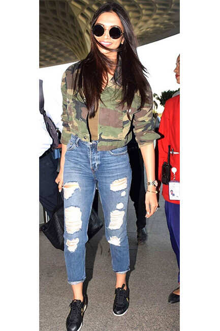 IN PICS: Deepika Padukone oozes oomph as she arrives wearing an oversized  camo jacket at the airport