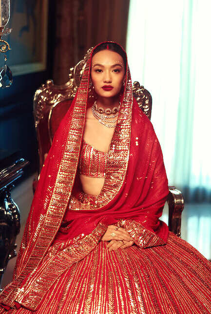 Photo of Red manish malhotra bridal lehenga