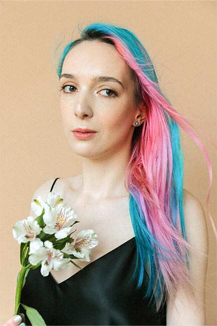 Beautiful young woman with foil on her hair. Bleaching or dyeing