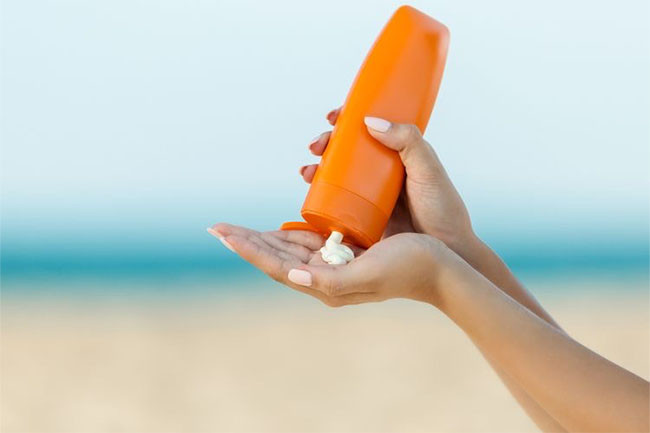 Summer skincare - apply sunscreen.